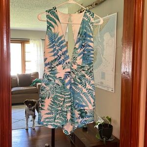 Leaf romper with deep V and cut on back